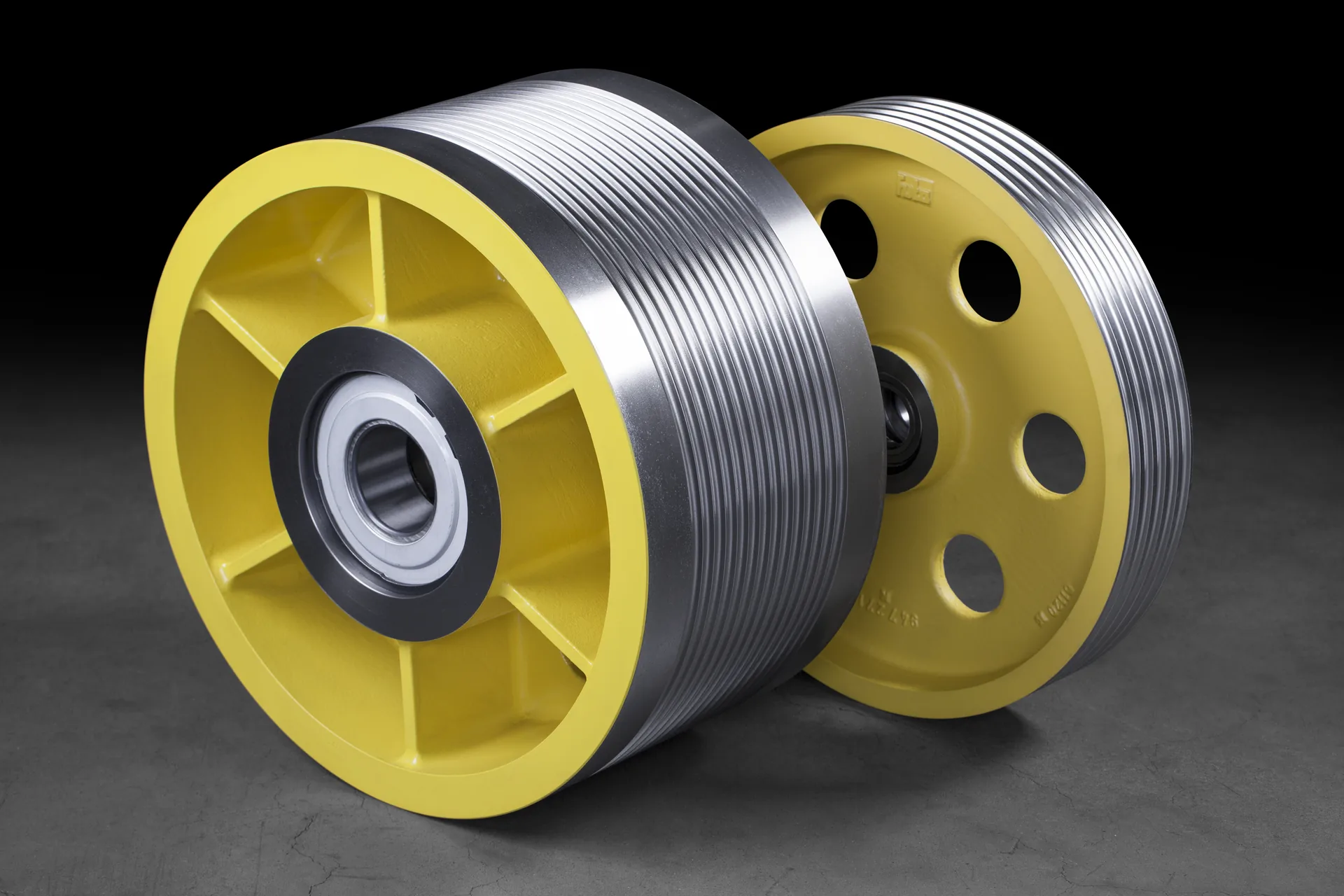 Two finished FUKA deflector sheaves with machined rope grooves and mounted bearings