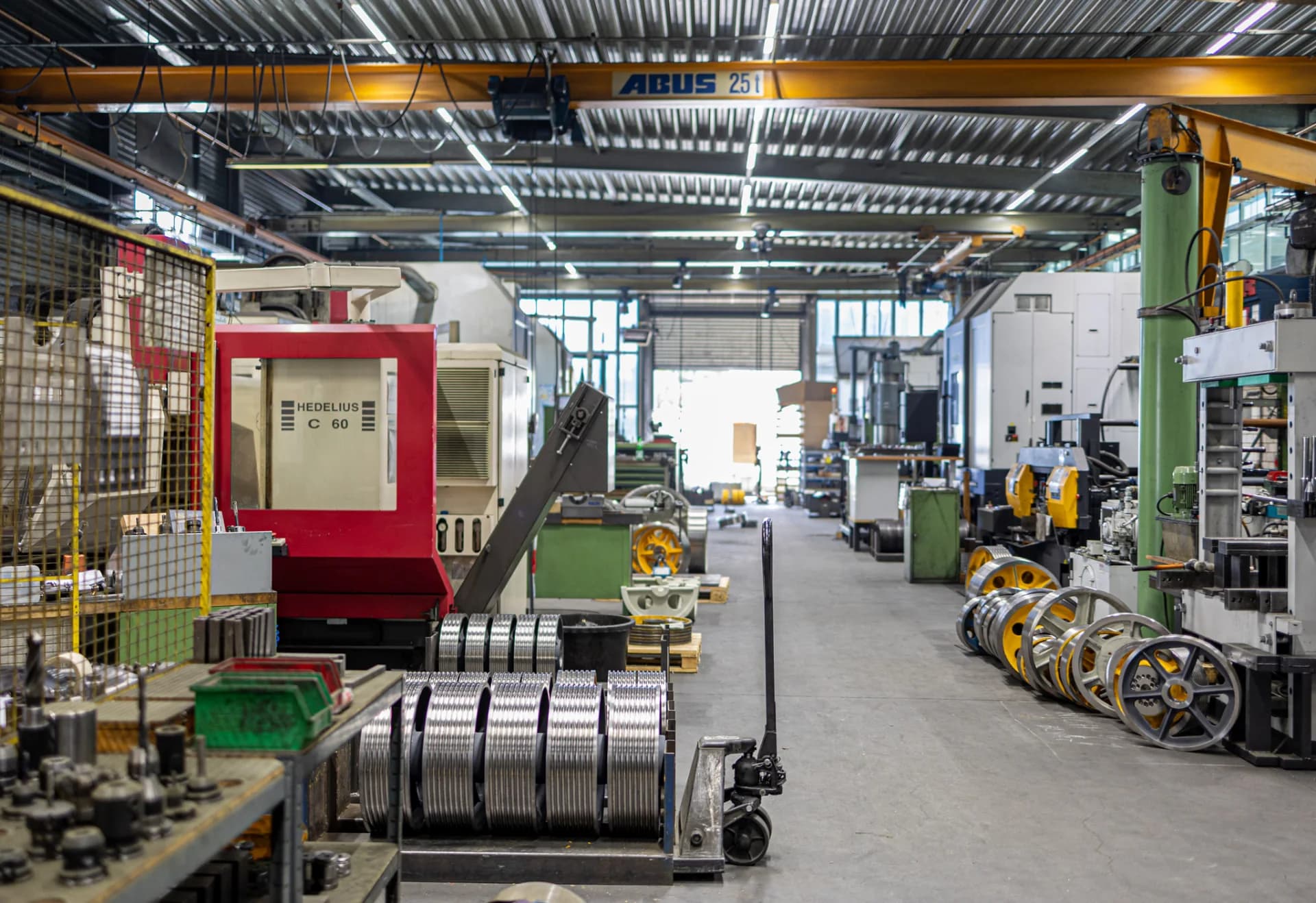 FUKA production hall in Cologne with CNC machining centres and elevator sheaves in process